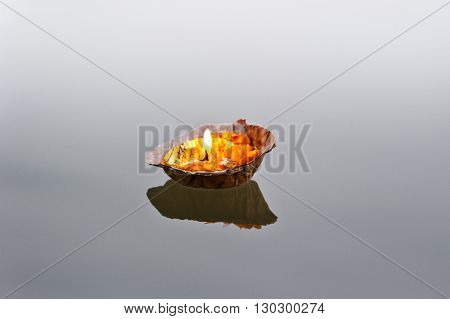 Burning pooja candle at aarti ceremony on the river Ganges Varanasi India