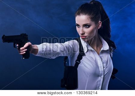 special tactics sexy woman holding up her weapon