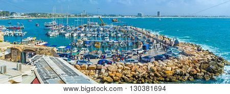 ACRE ISRAEL - FEBRUARY 20 2016: The sailing yachts and the fish boats in marina of Akko one of the best city locations on February 20 in Acre.