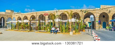 ACRE ISRAEL - FEBRUARY 20 2016: The old Akko offers various cafes and restaurants to taste the local cuisine the Khan e-Shu'arda medieval complex is one of the best choices on February 20 in Acre.