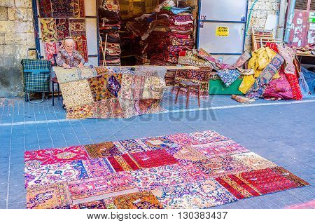 TEL AVIV ISRAEL - FEBRUARY 25 2016: The beautiful patchwork rugs made out of vintage kilim remnants in the flea market of Jaffa on February 25 in Tel Aviv.
