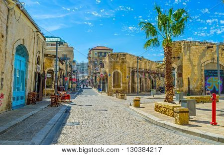 TEL AVIV ISRAEL - February 25 2016: The old street of Jaffa with numerous shops cafes and art galleries on February 25 in Tel Aviv.