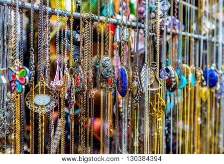 TEL AVIV ISRAEL - FEBBRUARY 25 2016: The pendants and lockets in the jewelry stall of the Jaffa flea market on February 25 in Tel Aviv.