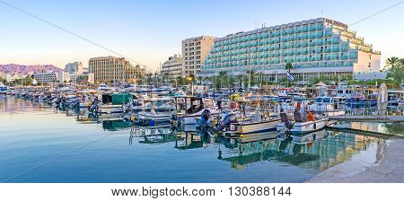 EILAT ISRAEL - FEBRUARY 23 2016: The fresh evening air and nice cityscape make port the perfect place for the walks on February 23 in Eilat.