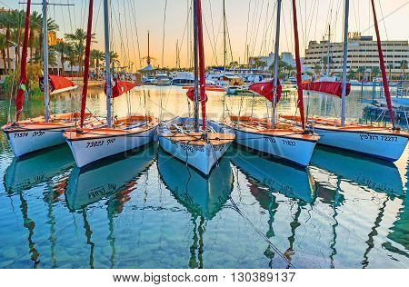 EILAT ISRAEL - FEBRUARY 23 2016: The yacht sport is very popular in Eilat so in the evening there are a lot of yachts in harbor on February 23 in Eilat.