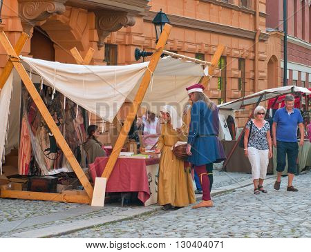 TURKU FINLAND 30 JUNE: The Medieval Market of Turku is historical reenactment event and includes a handicrafts market with participants garbed in period costumes on june 30 2013 in Turku Finland.