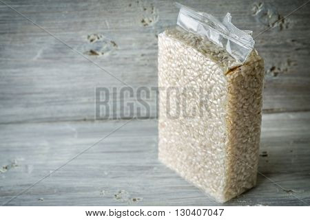 Packaging with Arborio rice on old blue boards horizontal