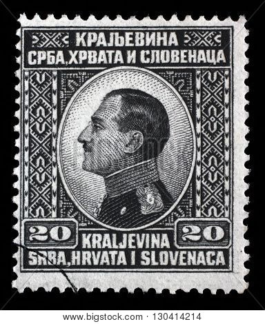 ZAGREB, CROATIA - SEPTEMBER 13: A stamp printed in Yugoslavia (Kingdom Serbia, Croatia and Slovenia) shows King Alexander I of Yugoslavia, circa 1924, on September 13, 2014, Zagreb, Croatia