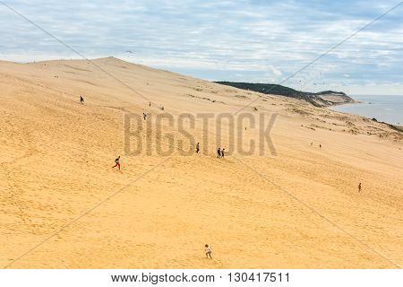People Visiting The Highest Sand Dune Of Pyla In Europe