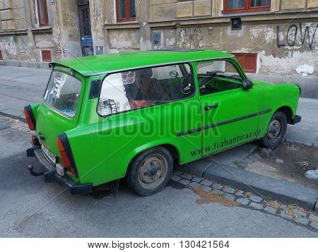 BRNO CZECH REPUBLIC - CIRCA MAY 2016: Green Trabant car parked in a street of the city centre