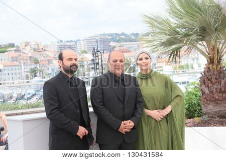 Actor Ali Mosaffa, actress Sahar Dolatshahi and director Behnam Behzadi attend the 'Inversion' Photocall during the 69th annual Cannes Film Festival at the Palais on May 18, 2016 in Cannes, France.