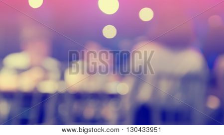 Blurred defocused of light in pub city abstract background purple and violette tone