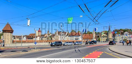 Lucerne, Switzerland - 7 May, 2016: pedestrians and traffic on the Seebruecke bridge. The Seebruecke bridge connects the historical and contemporary parts of the city of Lucerne. Lucerne is a city in central Switzerland.