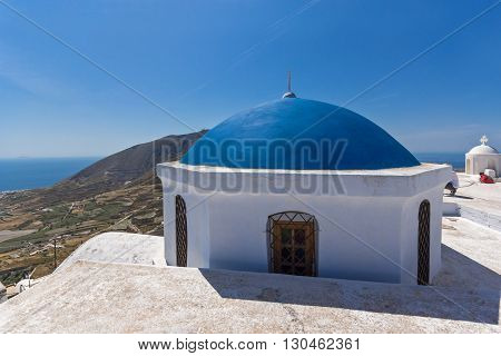 Blue roof of church and Panoramic view to Santorini island, Thira, Cyclades, Greece