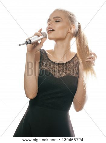 young pretty blond woman singing in microphone isolated close up karaoke singer