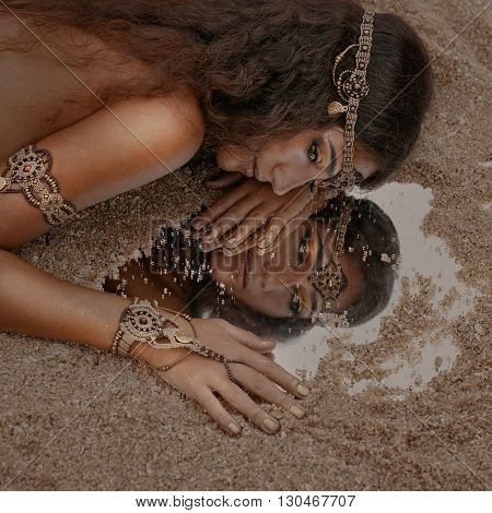 Attractive young tribal woman in ethnic jewelry