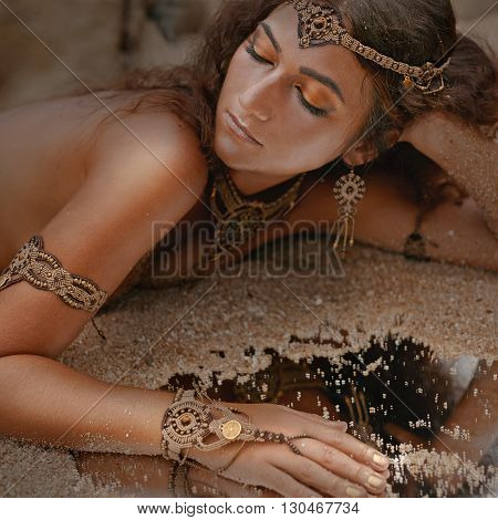 Attractive young tribal woman in ethnic jewelry