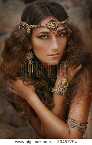 Attractive young tribal woman in ethnic jewelry