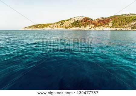 Calm bay with clear water and green trees. Skopea LImani region, Turkey