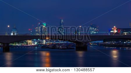 London UK - May 11 2016 - London cityscape at night including St Paul's Cathedral OXO Tower and Waterloo Bridge