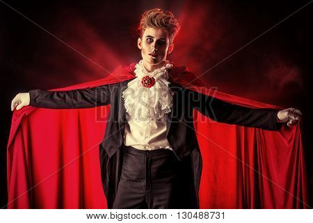 Bewitching handsome male vampire. Halloween. Dracula costume.