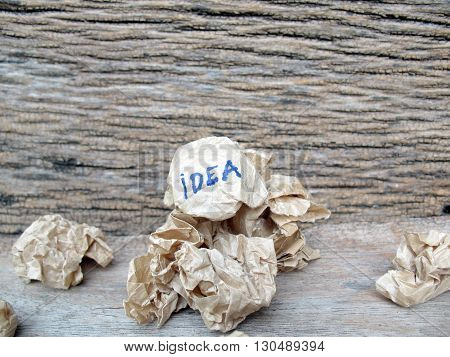 concept creased paper of idea on wooden