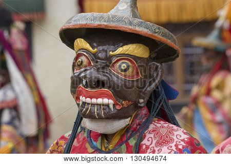 LAMAYURU INDIA - JUNE 13 2015: An unidentified buddhist lamas dressed in mystical mask dancing Tsam mystery dance in time of Yuru Kabgyat Buddhist festival at Lamayuru Gompa Ladakh North India