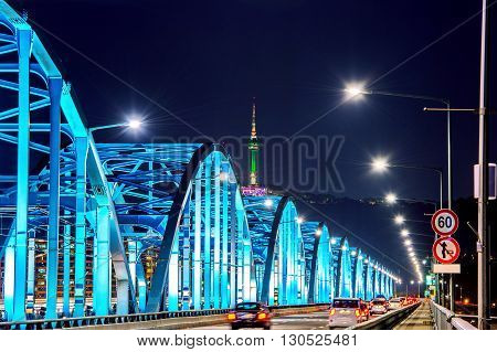 View of downtown traffic at Dongjak Bridge and Seoul tower over Han river in Seoul South Korea.