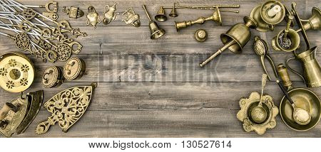 Kitchen table with antique tools and utensils. Vintage brass table ware
