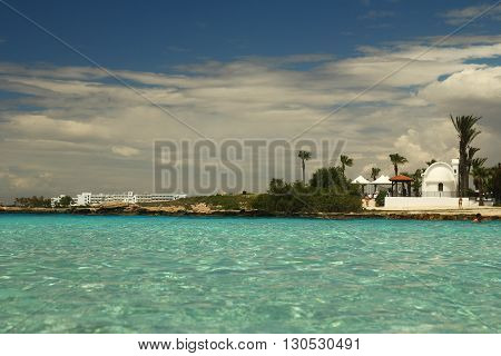 landscape from the sea with church to the shore background