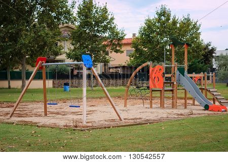 Сhildren playground Multi  Unit with swings, see saw, springers, agility equipment, slide and sand pit