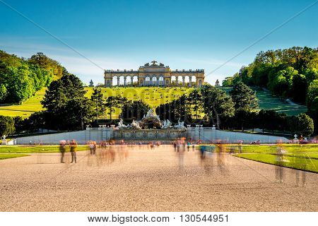 VIENNA, AUSTRIA - CIRCA APRIL 2016: Gloriette building in Schonbrunn gardens. This Palace is one of the most important historical monuments in Austria. Long exposure technic with blurred people