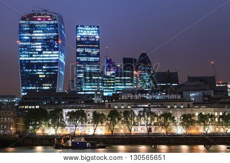 LONDON UNITED KINGDOM - 19 MAY 2016: London city skyscrapers view over Thames River During Night Time