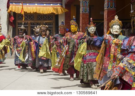 LAMAYURU INDIA - JUNE 13 2015: An unidentified buddhist lamas dressed in mystical mask dancing Tsam mystery dance in time of Yuru Kabgyat Buddhist festival at Lamayuru Gompa Ladakh North India