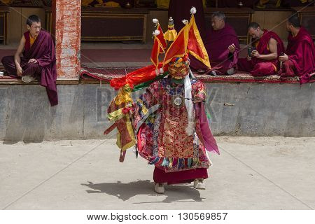 LAMAYURU INDIA - JUNE 13 2015: An unidentified buddhist lamas dressed in mystical mask dancing Tsam mystery dance in time of Yuru Kabgyat Buddhist festival at Lamayuru Gompa Ladakh North India