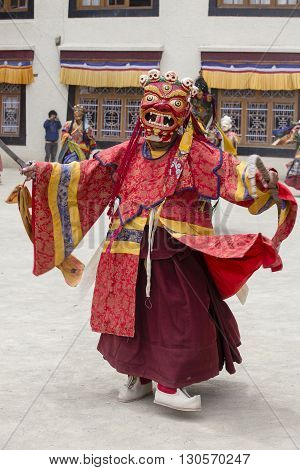 LAMAYURU INDIA - JUNE 13 2015: An unidentified buddhist lamas dressed in mystical mask dancing Tsam mystery dance in time of Yuru Kabgyat Buddhist festival at Lamayuru Gompa Ladakh North India