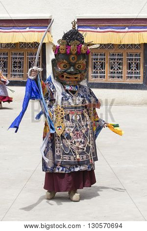 LAMAYURU INDIA - JUNE 13 2015: An unidentified buddhist lamas dressed in mystical mask dancing Tsam mystery dance in time of Yuru Kabgyat Buddhist festival at Lamayuru Gompa Ladakh North India