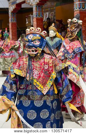 LAMAYURU INDIA - JUNE 13 2015: An unidentified buddhist lamas dressed in mystical mask dancing Tsam mystery dance in time of Yuru Kabgyat Buddhist festival at Lamayuru Gompa Ladakh North India