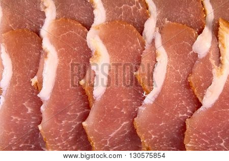 Slices of pork balyk (baked pork flesh). Top view