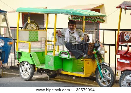 auto rikshaw puller man colorful rajasthan india