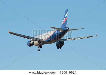 SAINT PETERSBURG, RUSSIA - MARCH 20, 2016: Flying in the blue sky Airbus A320-214 