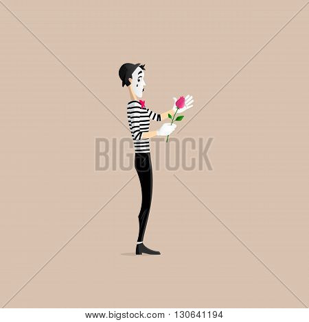A Mime performing a pantomime covering a flower - a red rose