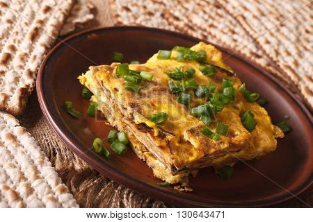 Jewish Cuisine: Matzah Brei With Green Onions Close-up. Horizontal