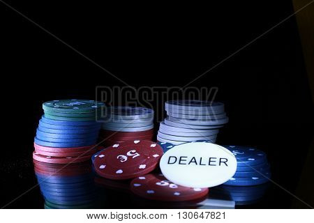 gambling chips on the black background casino