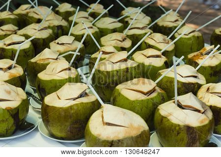 Shot of coconuts and straws ready for those who need refreshment.