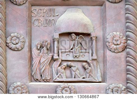PISA, ITALY - JUNE 06, 2015: Resurrection of Christ on the San Ranieri gate of the Cathedral St. Mary of the Assumption in Pisa, Italy on June 06, 2015