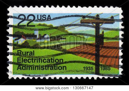 USA -CIRCA 1985: A stamp printed in United States of America shows Electrified Farm, Rural Electrification Administration, Circa 1985