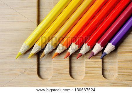 Color spectrum palette on wooden table background