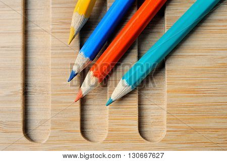 Four Color pencil composition still life with wooden background