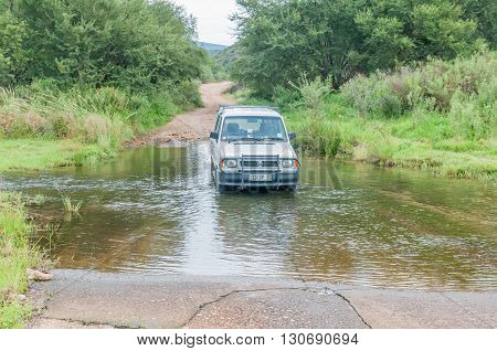 BAVIAANSKLOOF SOUTH AFRICA - MARCH 6 2016: The road in the wilderness area of the Baviaanskloof (baboon valley) crosses the Baviaans River on a concrete causeway one of many such crossings